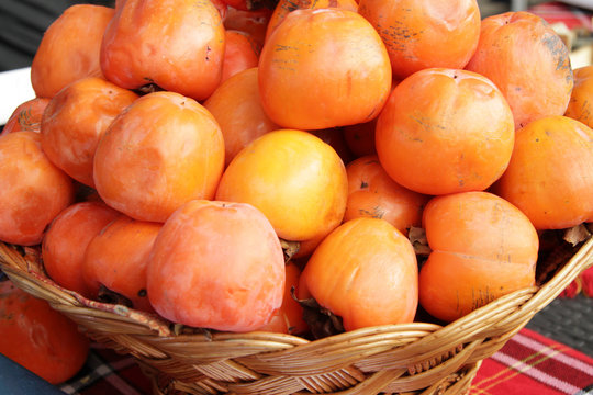 Ripe organic persimmon fruit. Persimmon pattern.