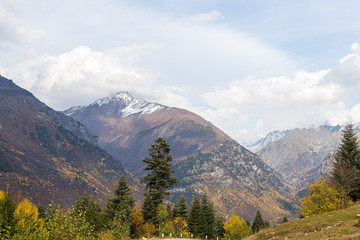 Panoramic  view snow-capped peaks of mountains with low clouds in Svaneti, in the mountainous part of Georgia