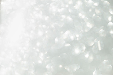 Abstract blurred shiny silver bokeh background, holiday and festive season concept background