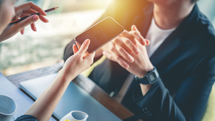 Journalist use a smartphone to recording conversation during an interview with businessman.