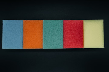 Sponges for washing dishes on a dark background close-up