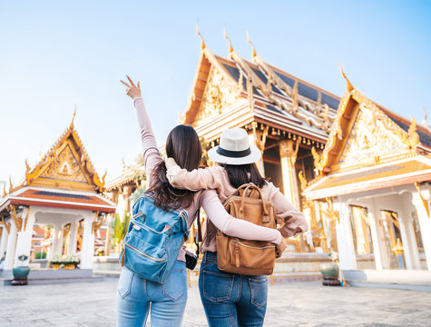 Two happy women traveler at temple in Thailand