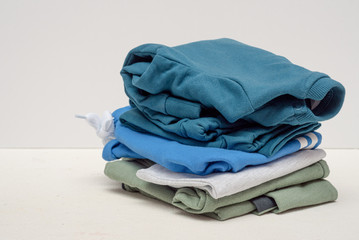Heap of dirty clothes on white background.
