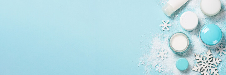 Natural cosmetics for winter on blue.