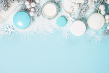 Natural cosmetics for winter on blue.