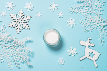 Natural cosmetics for winter on blue.