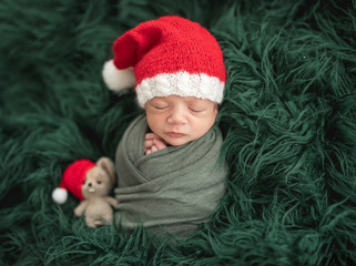 Adorable newborn in santa hat