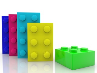 Toy bricks in different colors and sizes on a white background