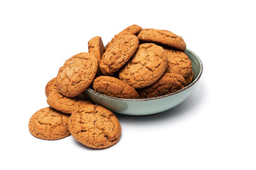 fresh tasty oatmeal cookies in a turquoise plate on a white background