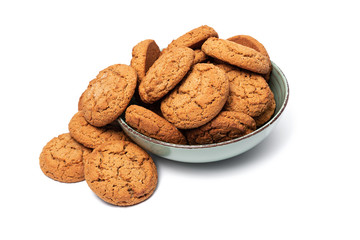 fresh tasty oatmeal cookies in a turquoise plate on a white background