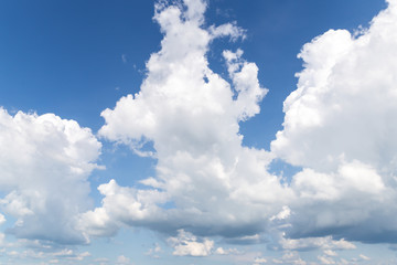 Obraz na płótnie Canvas White clouds on the bright sky
