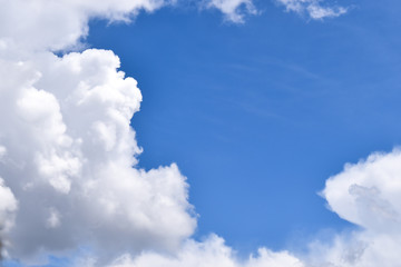 Towering cumulus cloud formation. Summer cloudy blue sky. 