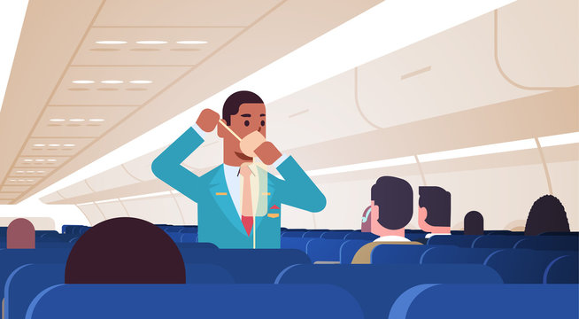 steward explaining for passengers how to use oxygen mask in emergency situation african american male flight attendant safety demonstration concept modern airplane board interior horizontal vector