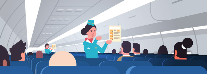 stewardess explaining for passengers instructions card female flight attendants safety demonstration concept modern airplane board interior horizontal portrait vector illustration