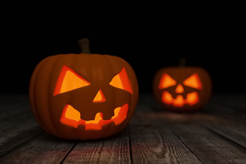 Halloween.Happy Halloween.Jack-O-Lanterns on a wooden surface.3D render.