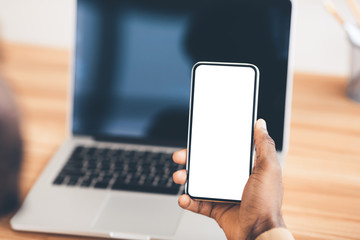 Afro man holding mobile with blank screen