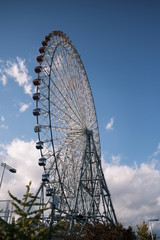 Ferris Wheel Over Blue Sky