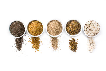 Assortment of different seeds in bowl isolated on white background. Pumpkin, linen, chia, sunflower, and sesame seeds