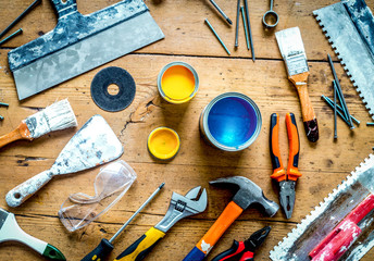 building implements set for repair on wooden background top view