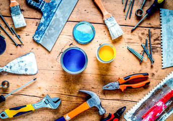 building implements set for repair on wooden background top view
