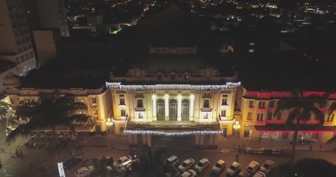 Aerial view of Pedro II Theater at night in December. Buildings and square XV all adorned with Christmas lights. Ribeir&atilde;o Preto, S&atilde;o Paulo / Brazil. 4K.
