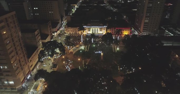 Aerial view of Pedro II Theater at night in December. Buildings and square XV all adorned with Christmas lights. Ribeir&atilde;o Preto, S&atilde;o Paulo / Brazil. 4K.