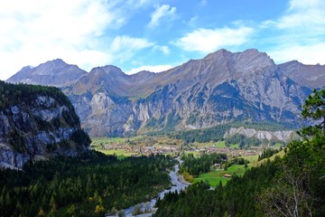 Fototapeta na wymiar Gorgeous view of gigantic mountains and Kandersteg village which is a high-altitude resort village in the Bernese Oberland region of Switzerland.