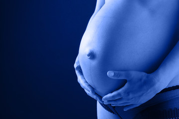 the belly of a pregnancy woman