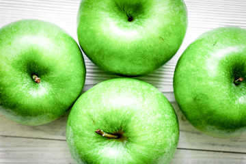 summer food with green apples on white background