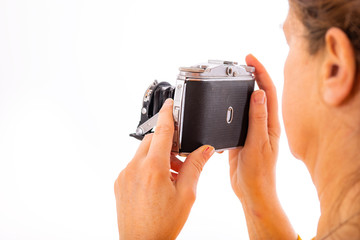 Woman holds nostalgia camera in her hands