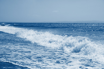 Fototapeta premium Seascape toned in trendy 2020 classic blue color. Sea background. Ocean wave