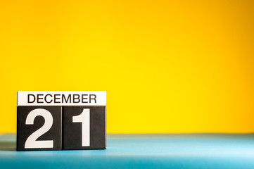 December 21st. Image 21 day of december month, calendar on yellow background with empty space for text