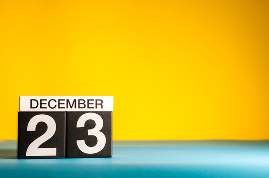 December 23rd. Image 23 day of december month, calendar on yellow background with empty space for text