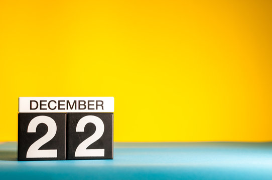 December 22nd. Image 22 day of december month, calendar on yellow background with empty space for text