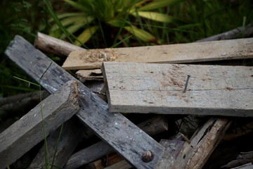 Old wooden pile that looks worthless and neil