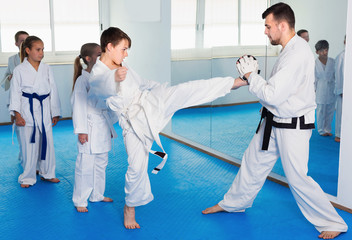 Boys trying in sparring to use new technique