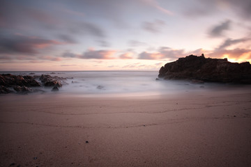 Fototapeta na wymiar Rocky beach at dusk