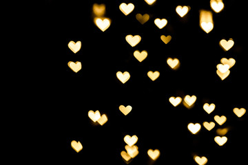 Festive overlay effect. Golden heart bokeh festive glitter background. Christmas, New Year and...