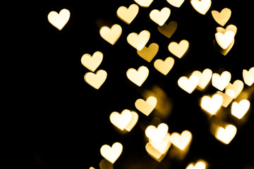 Festive overlay effect. Golden heart bokeh festive glitter background. Christmas, New Year and...