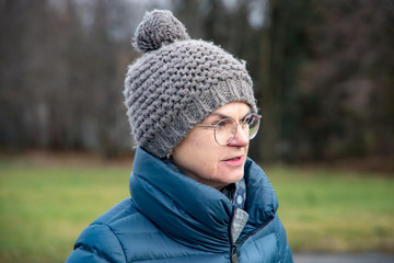 Woman with down jacket and wool hat