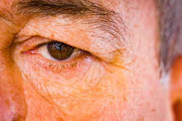Face detail with an older man's eyes