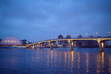 Large bridge illuminated on a winter evening