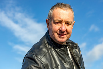 Senior man with black leather jacket