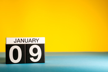 January 9th. Day 9 of january month, calendar on yellow background. Winter time. Empty space for...