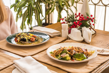 Served table with dishes. side view. light background