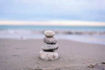 stacked rocks on calm beach