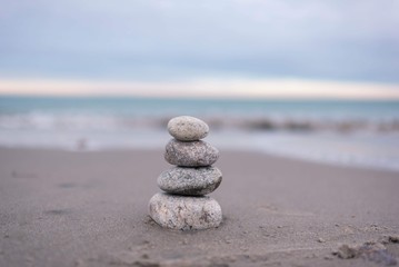 balanced rock on tranquil sea