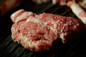 Korean BBQ, meat on iron plate 