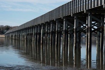 wooden bridge over bay water
