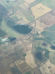 A mixture of dams and fields seen from a plane